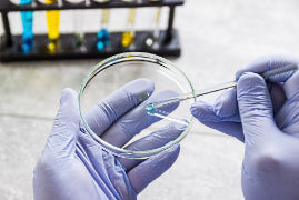 Why is the capillary spotter tube the key to perfect separation in TLC?
